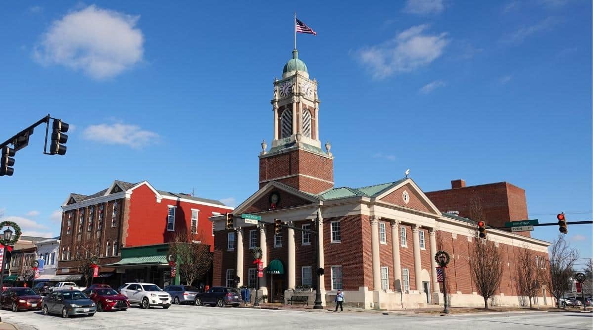 The Lebanon, Ohio City Hall is a government building located in downtown Lebanon, featuring a neoclassical architectural style with a red brick exterior, white columns, and a prominent clock tower.