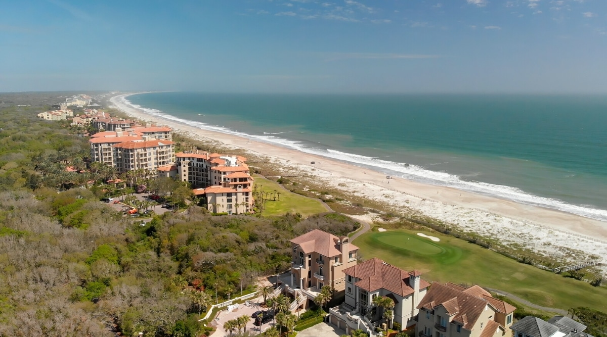 Amelia Island is a beautiful barrier island located on the northeast coast of Florida, known for its pristine beaches, clear waters, and rich history. The island has sandy beaches with crystal clear waters, a city center with boutiques, galleries and restaurants, as well as historical sites.