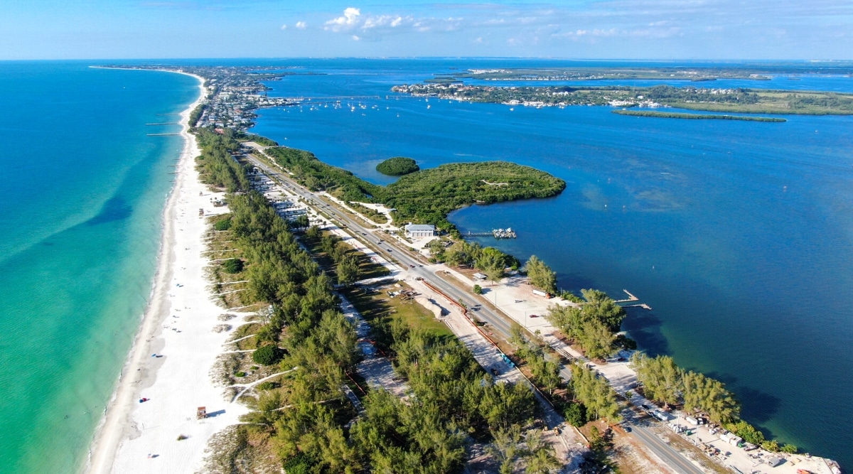 Anna Maria Island is a charming barrier island located on the west coast of Florida, known for its pristine white sand beaches, clear waters, and old Florida charm. The island has seven miles of beaches, historical sites, parks and nature reserves.