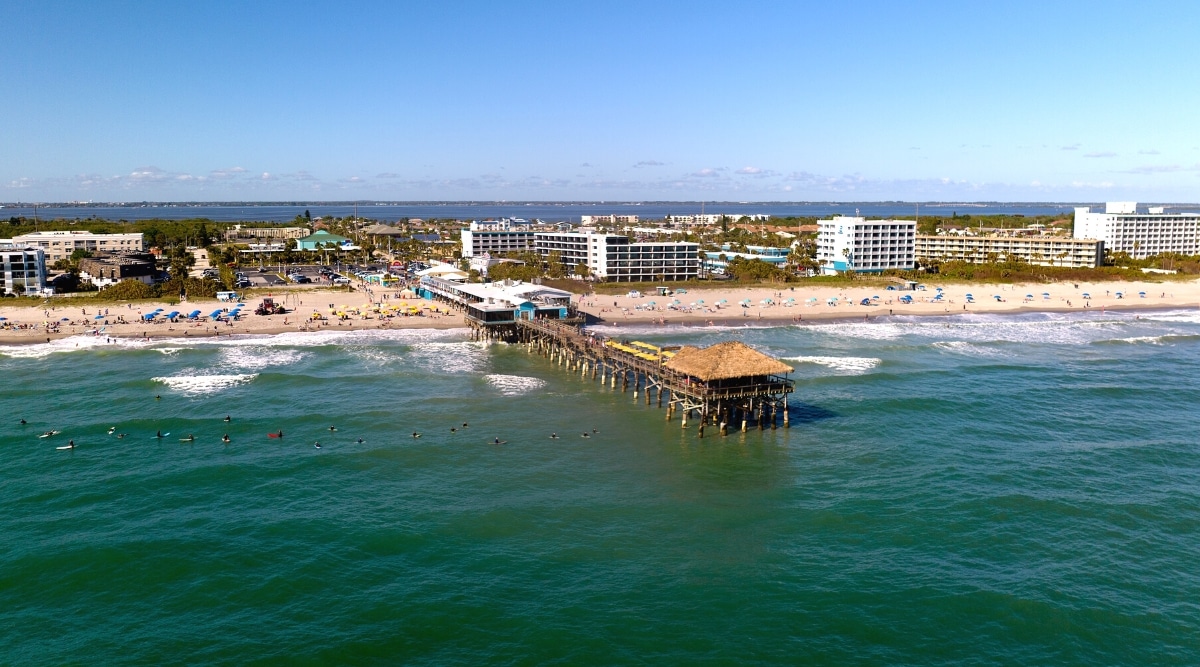 Cocoa Beach is a popular tourist destination located on the east coast of Florida, known for its beautiful beaches. The beach offers over six miles of white sand and warm green-blue waters. Also on the beach there is a long pier and many hotels, restaurants and shops for visitors.