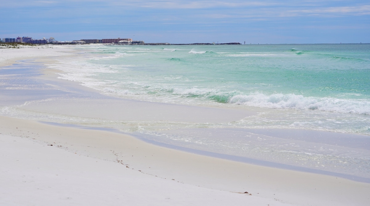 Destin Beach is located in the Emerald Coast of Florida and is known for its sugar-white sand and emerald green waters.