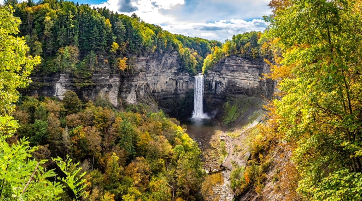 The Finger Lakes are a group of 11 long, narrow lakes located in central New York state. Pictured is one of the popular Taughannock Falls, located in Taughannock Falls State Park. This is one of the highest waterfalls, which is surrounded by high cliffs and a gorge.