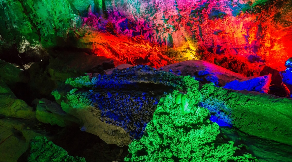 An image capturing the interior of Stark Caverns in Missouri. The photograph displays the subterranean features of the cavern, showcasing the geological formations and cavernous spaces. 