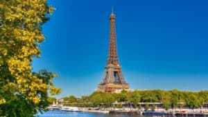 View of the Eiffel Tower in Paris. Rising majestically against the Parisian skyline, the iron lattice structure. It