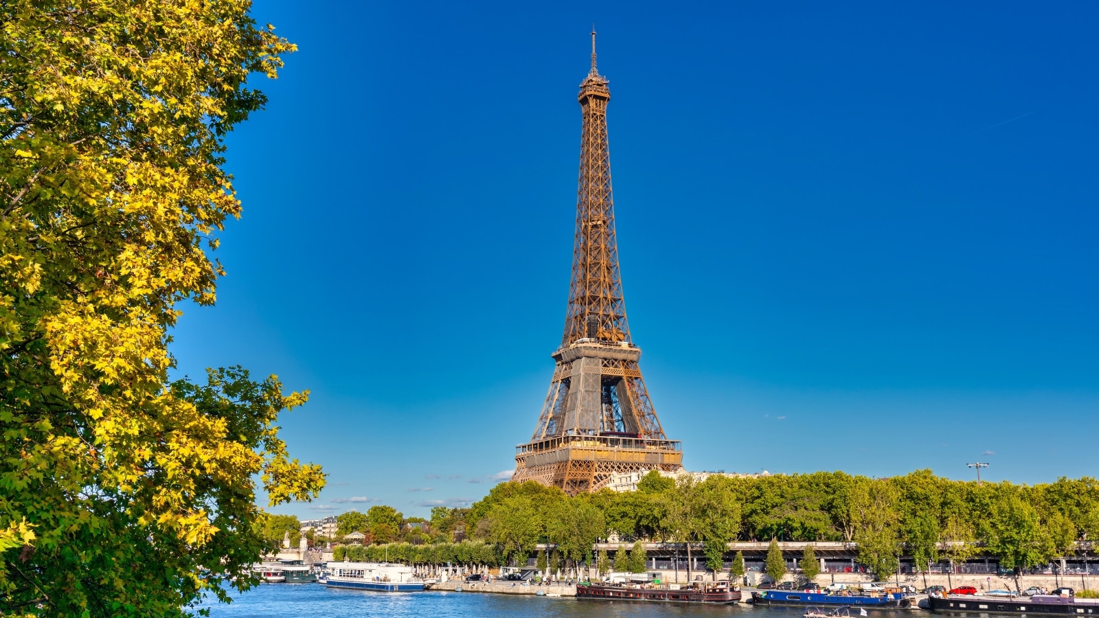 View of the Eiffel Tower in Paris. Rising majestically against the Parisian skyline, the iron lattice structure. It