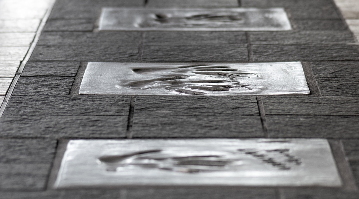 Close up shot of multiple hand prints down the Alley of Fame in Cannes France, where famous celebrities immortalize themselves into cement during the Cannes Film Festival.