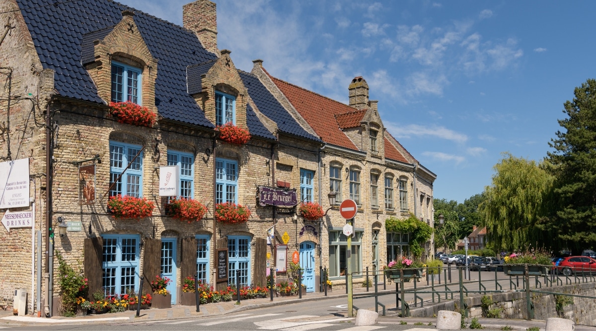 Traditional architecture styles in Bergues France on a bright summer day.