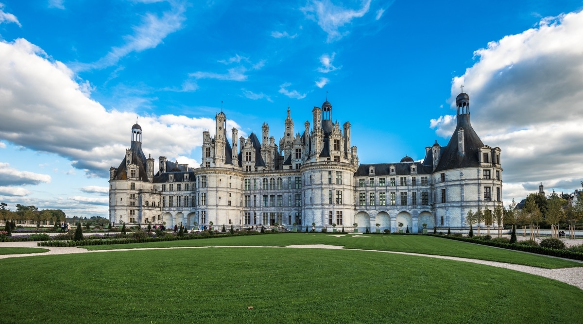 The Chateau de Chambord in Orleans, France, photographed from a distance on a clear sunny summer day.