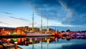 Dunkirk port at sunset lit up.