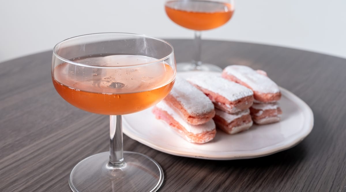 Close up of Rose sparkling Champagne and Pink Biscuits of Reims.