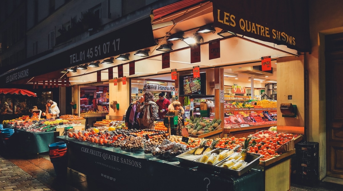 A produce market set up on the street on Rue Cler in Paris France. 