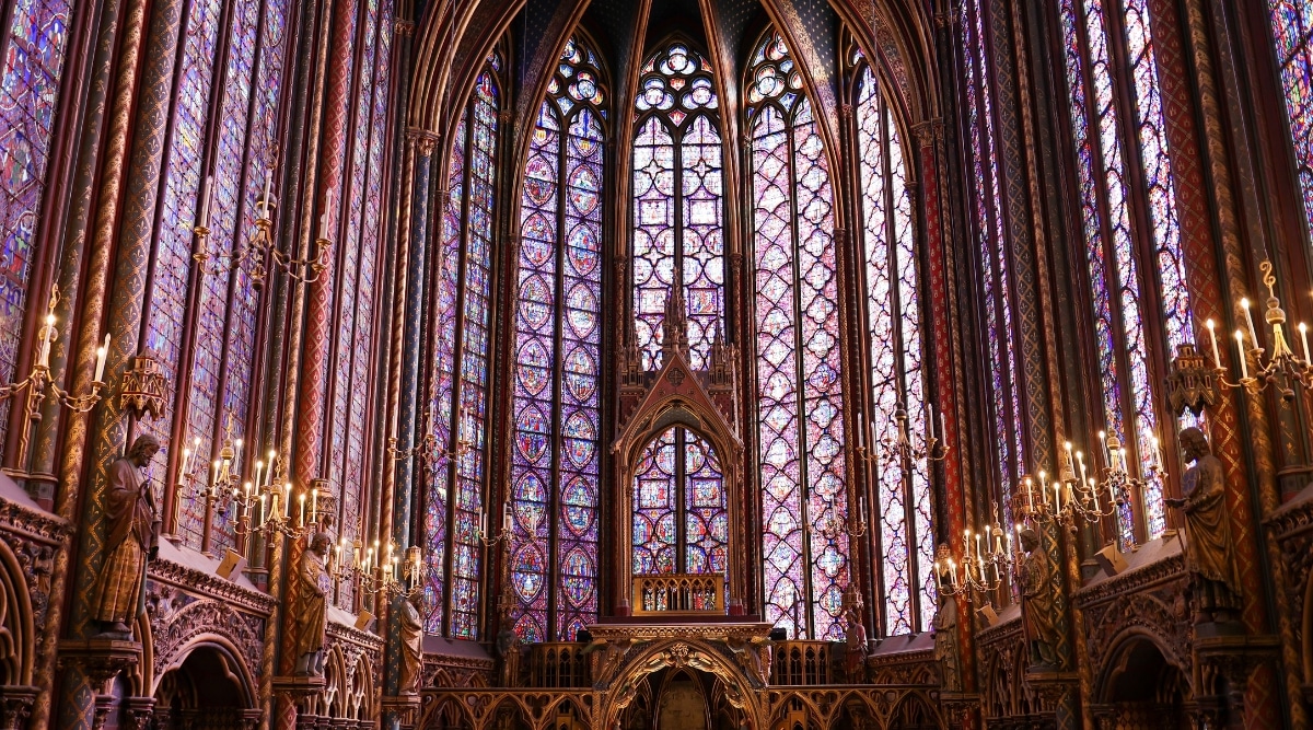 The chapel's upper level is a masterpiece of Gothic architecture, with its soaring stained glass windows that stretch almost from floor to ceiling. The intricate and vibrant stained glass depicts biblical stories in stunning detail. The lower level of Sainte-Chapelle features a more subdued but still impressive interior with its ribbed vaults and stone pillars.