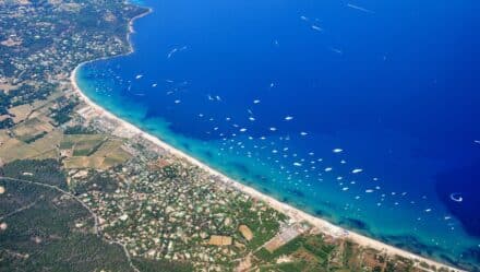 Arial shot of Plage de Pampelonne in St. Tropez, France, on a clear sunny summer day.