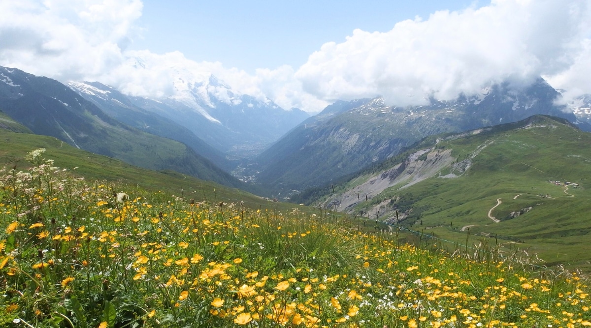 Col de Baume in Chamonix, France. Nestled within the embrace of the French Alps, the mountain pass offers breathtaking panoramic views of the surrounding alpine landscape. The meandering mountain trail, visible in the image.