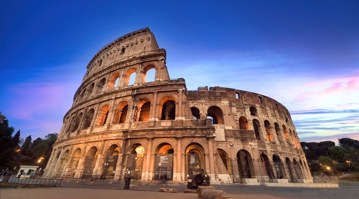 Colosseum in Rome. The image features the majestic amphitheater. The Colosseum's distinctive arches and tiers showcase the architectural brilliance of its time.