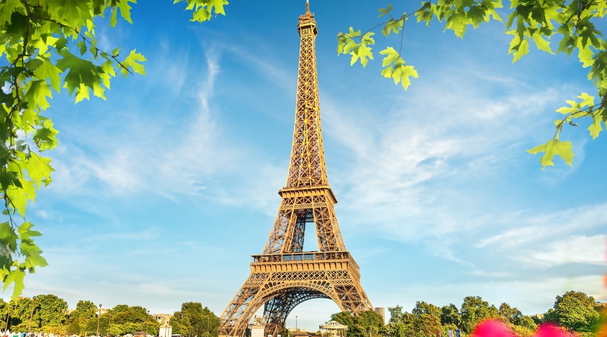 Eiffel Tower, Paris's symbol of elegance and architectural grandeur. The image features the wrought-iron lattice structure. The Eiffel Tower's intricate architectural details, from the lattice-work to the arches.