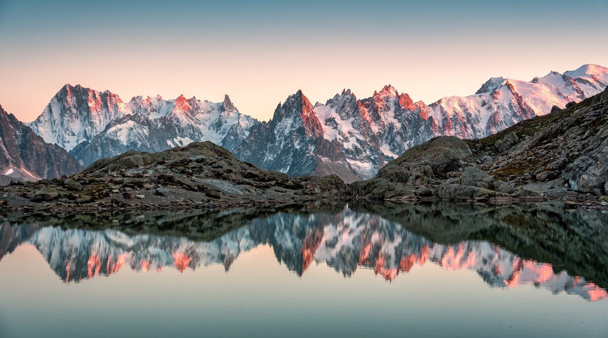 Nestled in the heart of the picturesque Chamonix Valley in France, the image of Lac Blanc (White Lake) unveils a scene of unrivaled natural beauty. Surrounded by towering alpine peaks. The crystal-clear waters of the lake perfectly mirror the surrounding landscape.