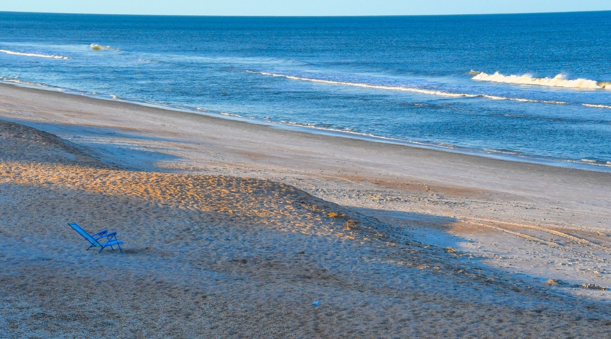 A photograph portraying North Park Beach in St. Augustine, Florida. The image captures the beach's sandy expanse along the shoreline.