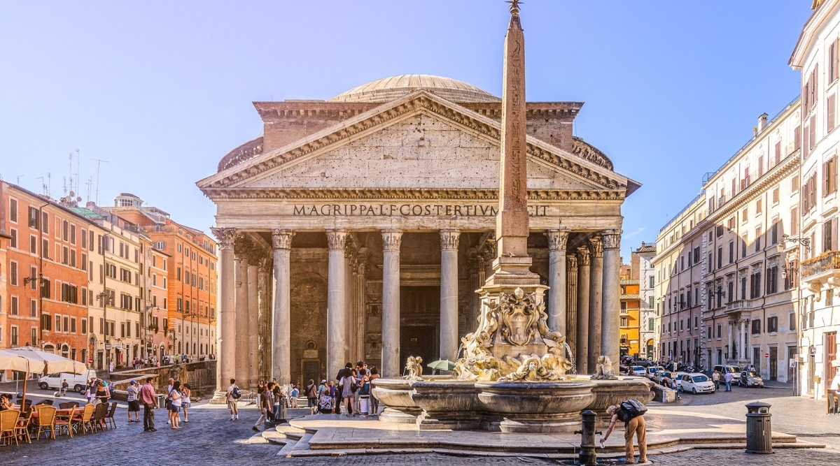 Pantheon, a symbol of ancient Roman architecture, in Rome. The image features the grand rotunda with its iconic dome, adorned by a central oculus that bathes the interior in natural light. The Pantheon's meticulously preserved facade, with its Corinthian columns and intricate details.