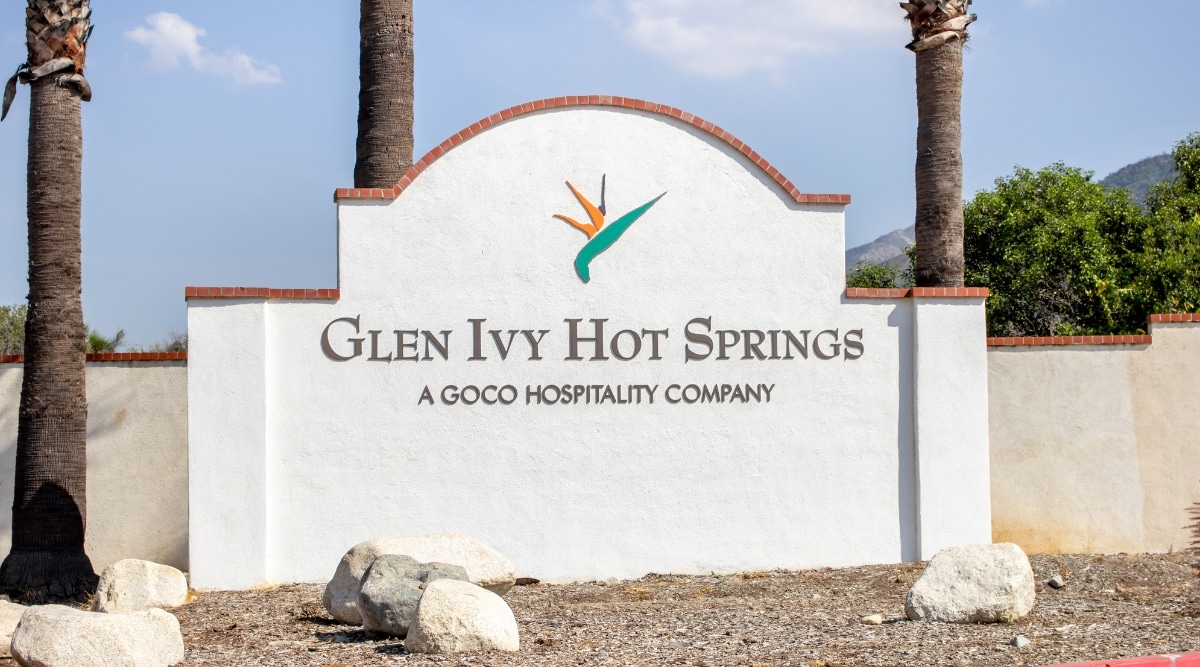 A close-up photograph capturing a stone sign on the ground at Glen Ivy Hot Springs in Los Angeles. The image features the sign's text and design, providing information or direction at the location.