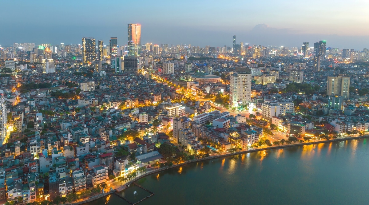 A view capturing the evening ambiance of Hanoi, Vietnam, with numerous street lamps illuminating the city streets. The image showcases the urban landscape, featuring the glow of streetlights against a backdrop of buildings.