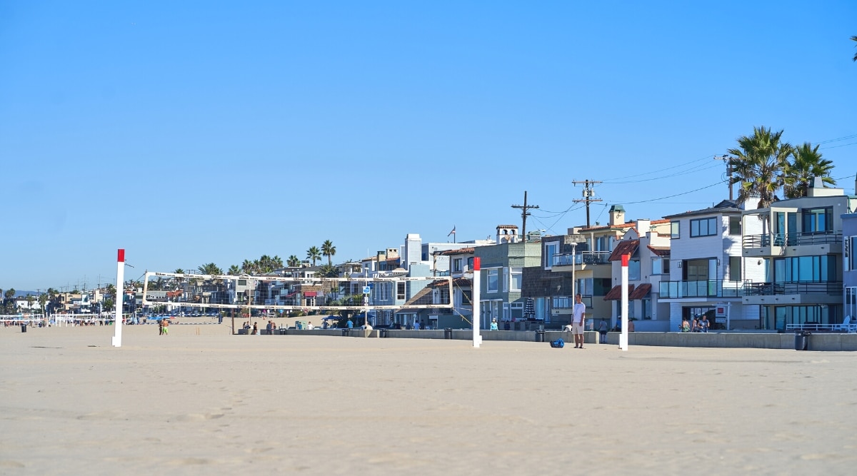 A scenic view of the Hermosa Beach Strand in Southern California, USA. The image captures the renowned beachfront, featuring the sandy shoreline. The scene includes the stretch of Hermosa Beach.