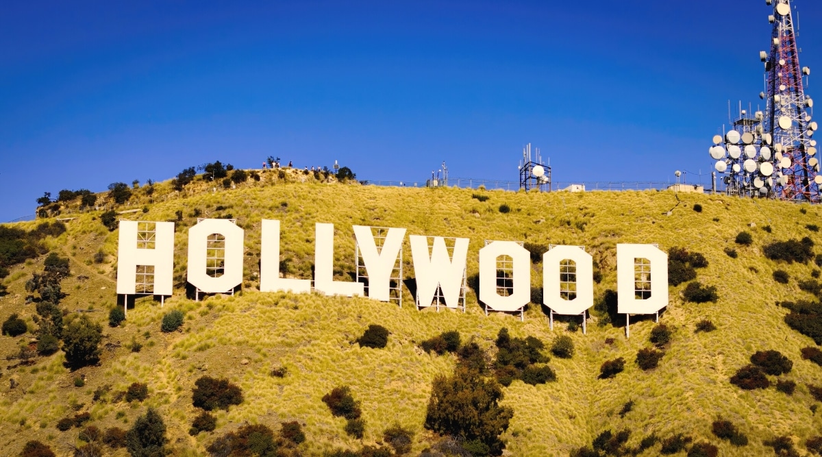 A close-up view capturing the Hollywood Sign in Los Angeles. The image provides a detailed perspective of the iconic sign, situated against the backdrop of the Hollywood Hills. The white letters are prominently featured, spelling 'Hollywood,' in a straightforward and recognizable font.