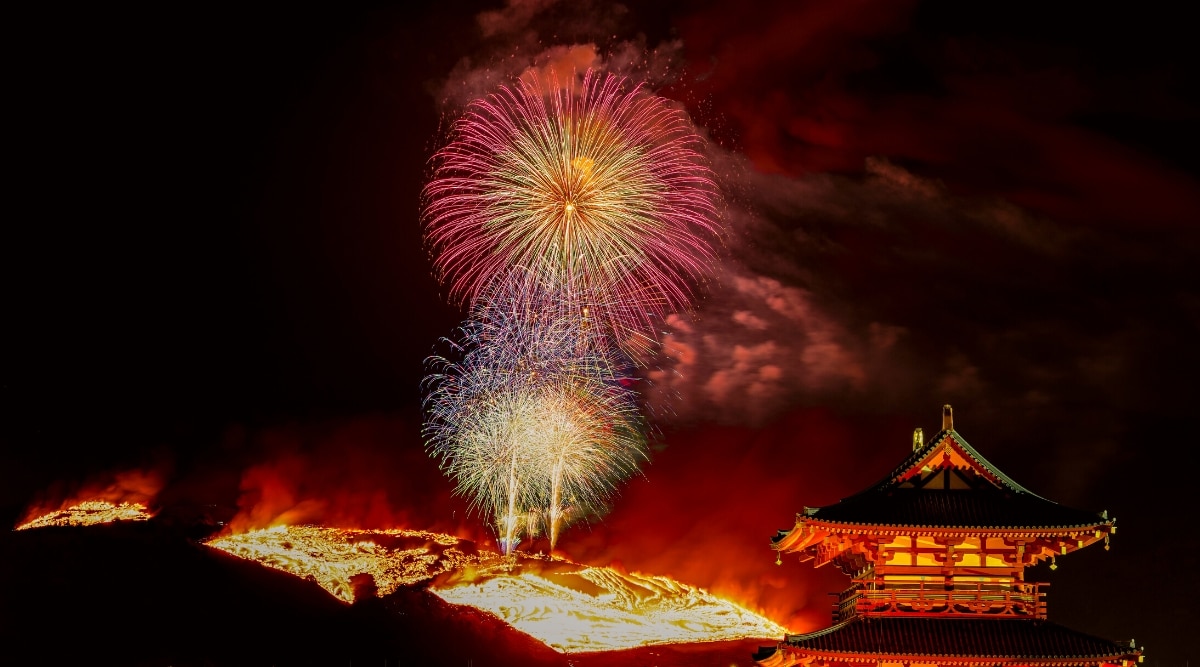 A photograph capturing fireworks and the mountain burning during the Mt. Wakakusa Yamayaki Festivals. 