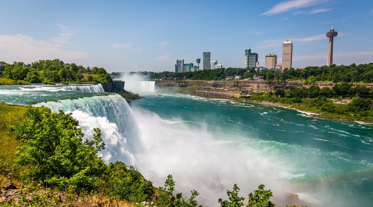 A photograph capturing Niagara Falls from the American vantage point. The image showcases the iconic waterfall with its cascading waters, surrounded by the natural landscape. The view includes the American Falls and Bridal Veil Falls.