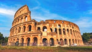 The Flavian Amphitheatre, commonly referred to as the Colosseum, depicted in its archaeological context in the heart of Rome. The image captures the iconic structure