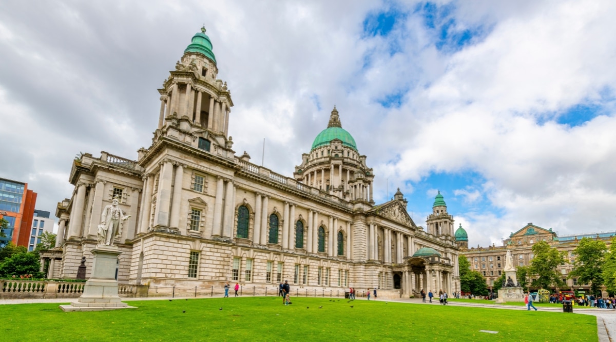 An image capturing Belfast City Hall, the civic building of Belfast City Council, situated in Donegall Square, Belfast, Northern Ireland. The photograph features the exterior of Belfast City Hall, a prominent architectural landmark. The building showcases a classical architectural style with its imposing facade.