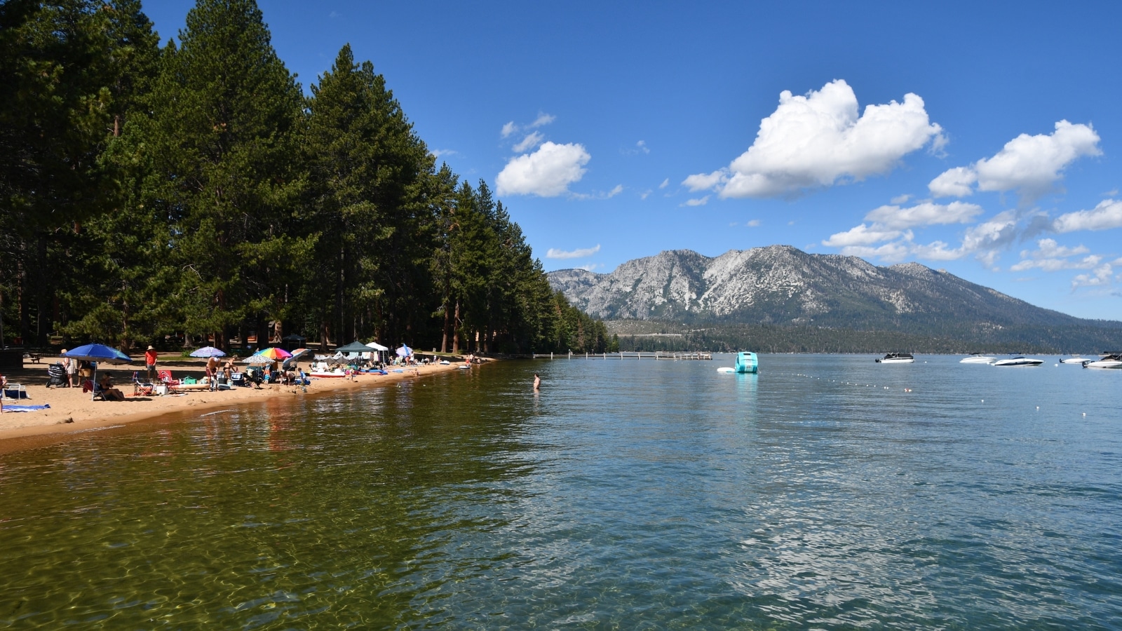 A photograph capturing South Lake Tahoe, California. The image provides a view of the landscape with the lake, surrounding terrain, and urban development in the vicinity.