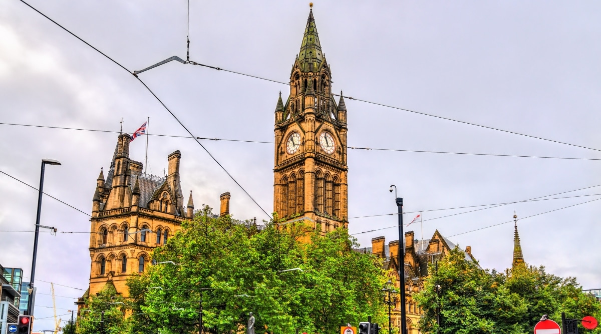 A photograph capturing Manchester Town Hall, a Victorian-era Neo-Gothic municipal building in Manchester, England.
