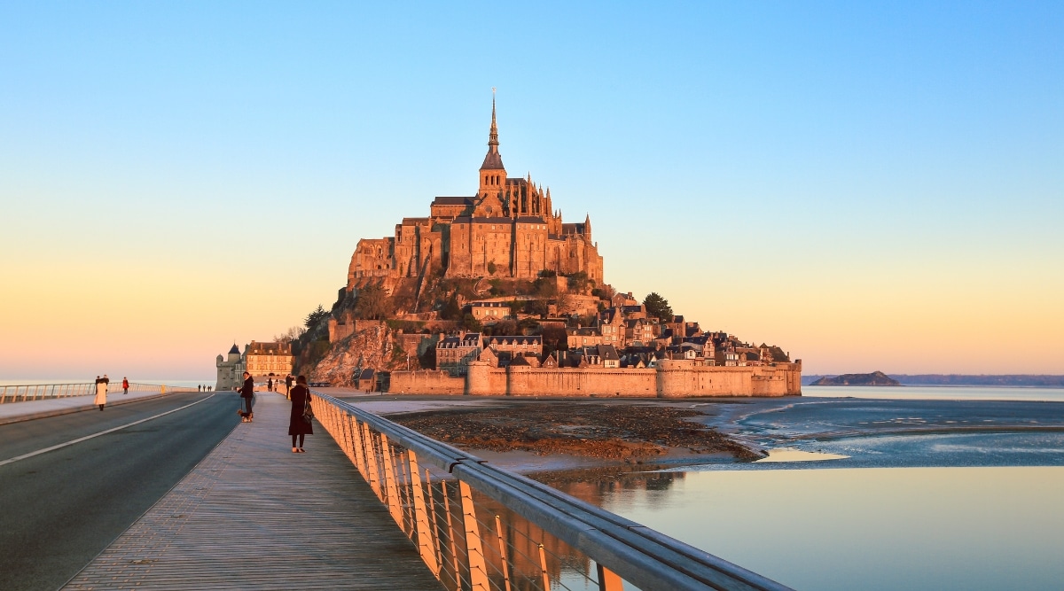 Morning sunrise on Mont Saint Michel and it's reflection in France.