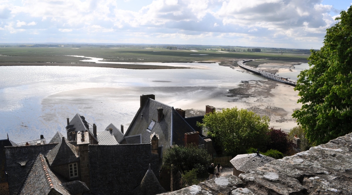 Views from the Mont Saint Michel monastery looking down over the bay as tides come back in.