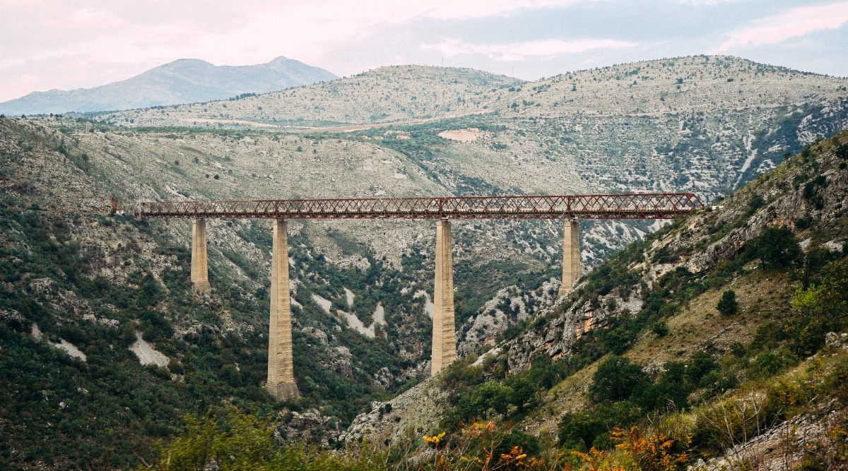 A straightforward image capturing the view of the Old Bridge adjacent to the railway connecting Serbia to Montenegro. The photograph depicts the bridge's structural elements and its location within the railway infrastructure.