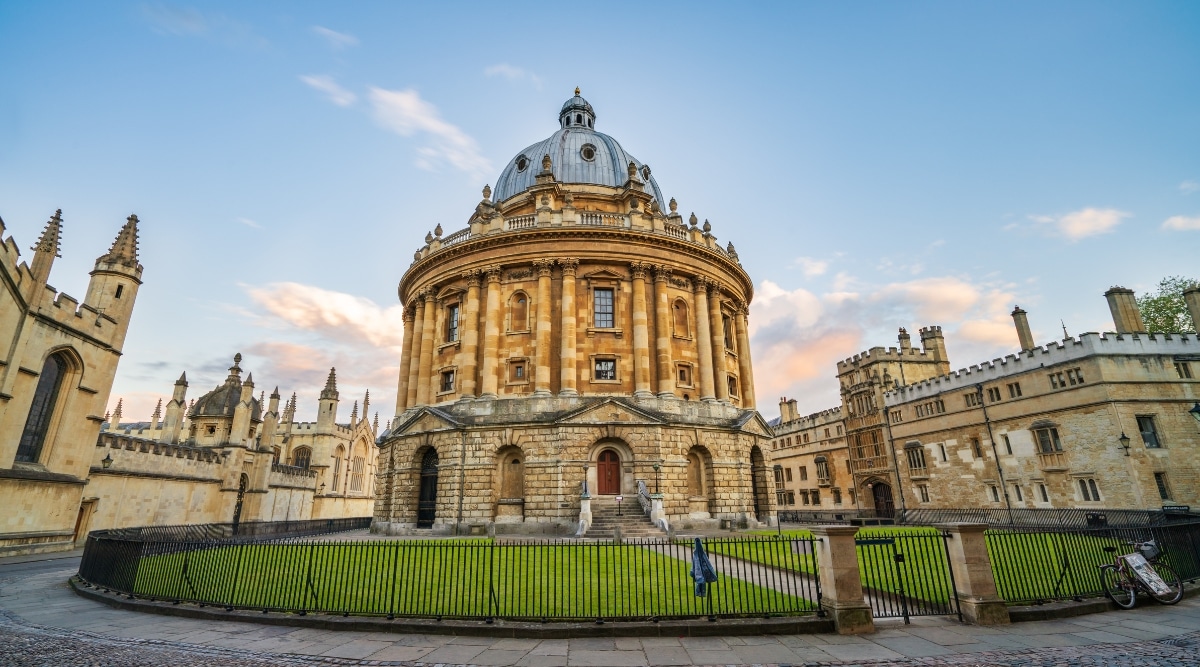 A photograph depicting the exterior of the Science Library in Oxford. The image showcases the architectural façade of the library building, which is characteristic of the historic structures in the Oxford University campus. The weather is clear, with minimal clouds in the sky.