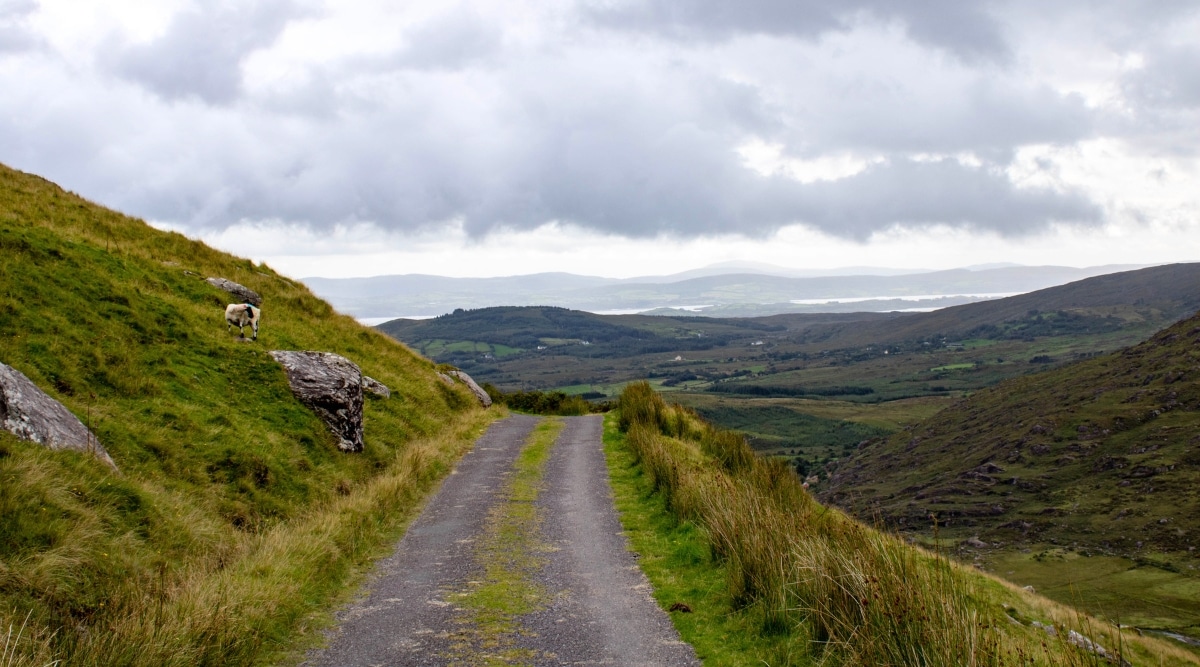 A photograph capturing the landscape of Priests Leap in County Cork. The image features the geographic expanse, showcasing the rolling hills and natural terrain. The scene depicts the characteristic topography of the region with minimal human presence. 