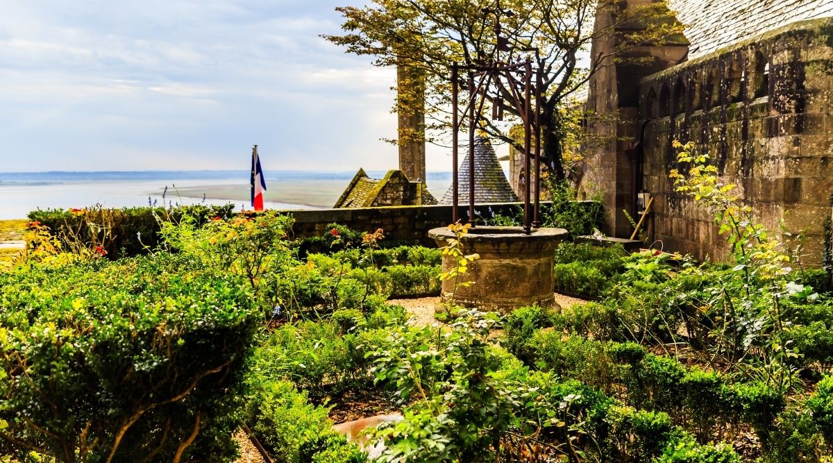 Mont Saint Michel Abbey gardens on a clear sunny day in France.