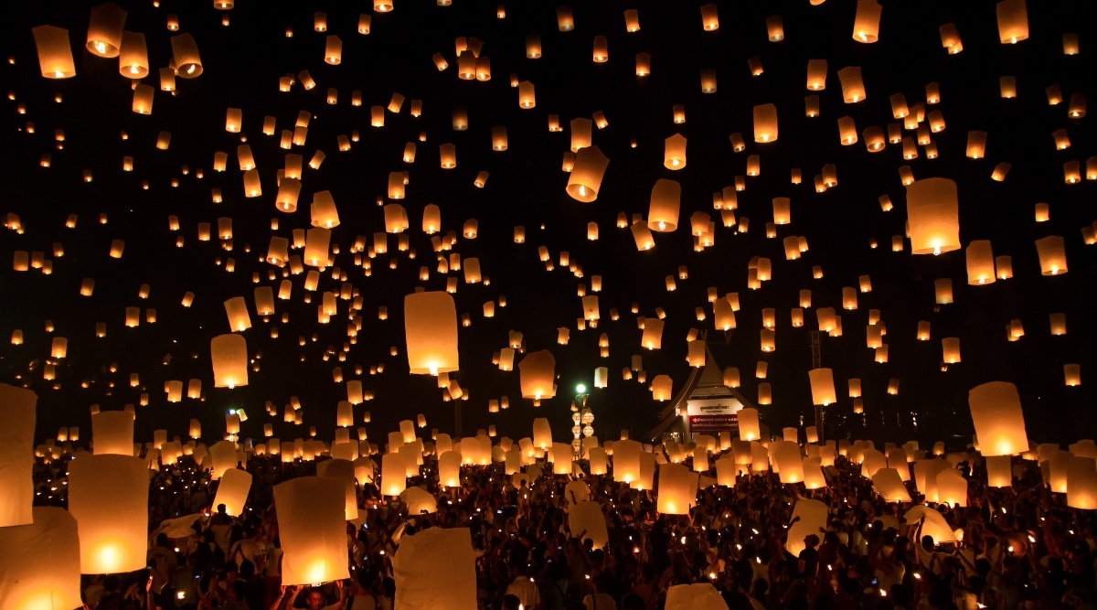 A photograph capturing numerous sky lanterns at the Sky Lantern Festival. The image showcases a multitude of lanterns released into the night sky, creating a visually striking display. 