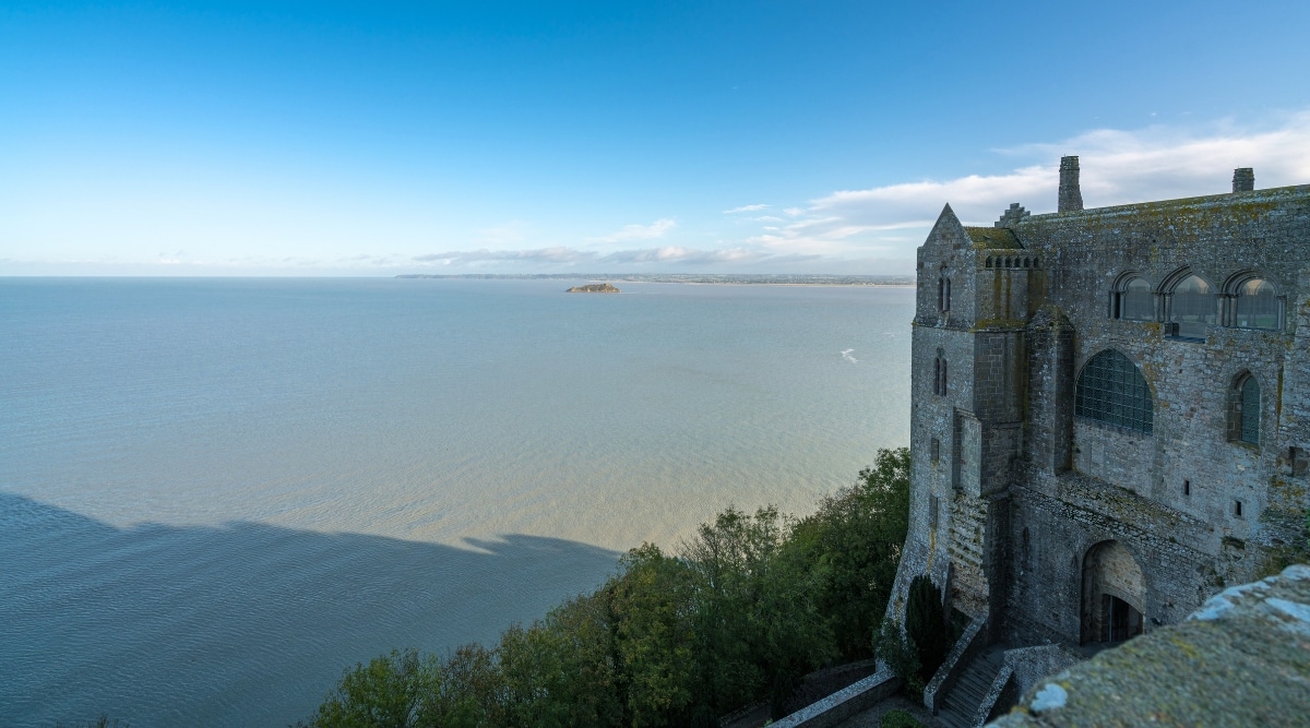 A panoramic view capturing the Atlantic coast from Mont-Saint-Michel, a town located in Normandy west of Paris.