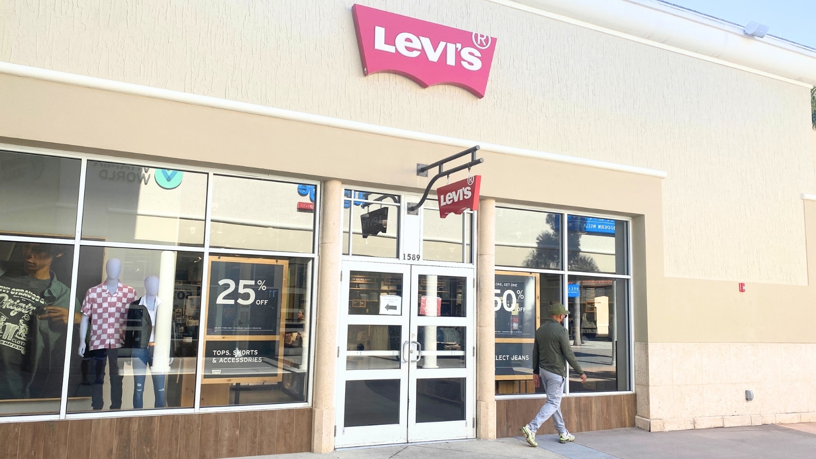 The image shows a close-up view of a Levi's store, characterized by its beige building walls.