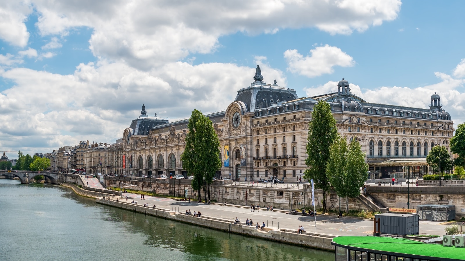  A panoramic view featuring Musee d'Orsay, Pont Royal, and the Seine River in Paris. 