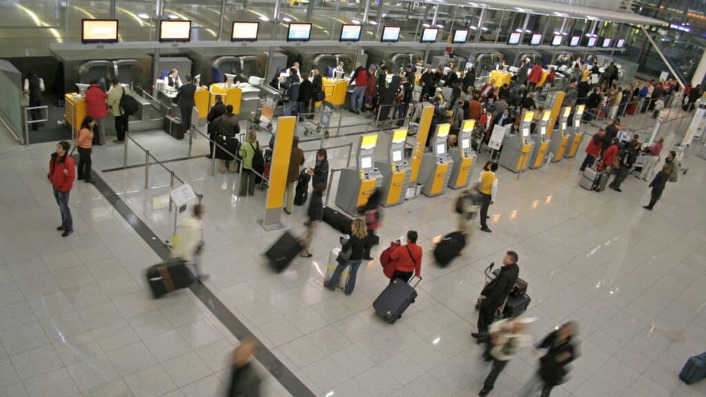 People in an Airport Traveling to New Locations