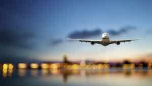 Plane Flying Out of Airport During Travel