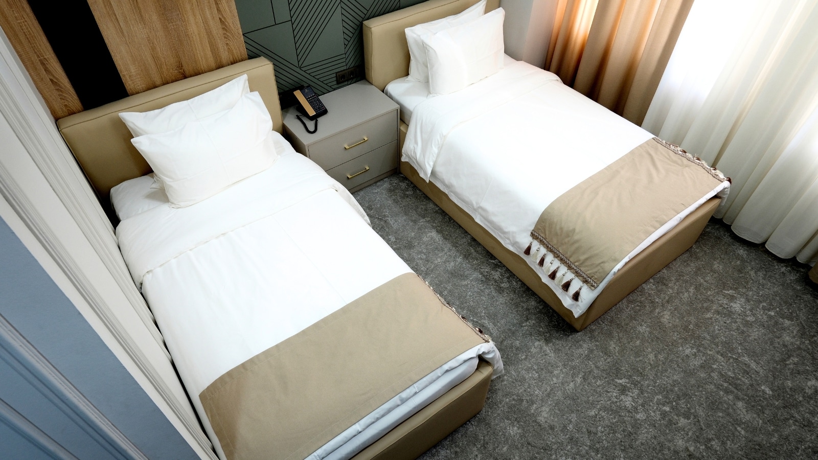 The image shows an aerial view of a double room. The room appears well-furnished with standard amenities, including beds.