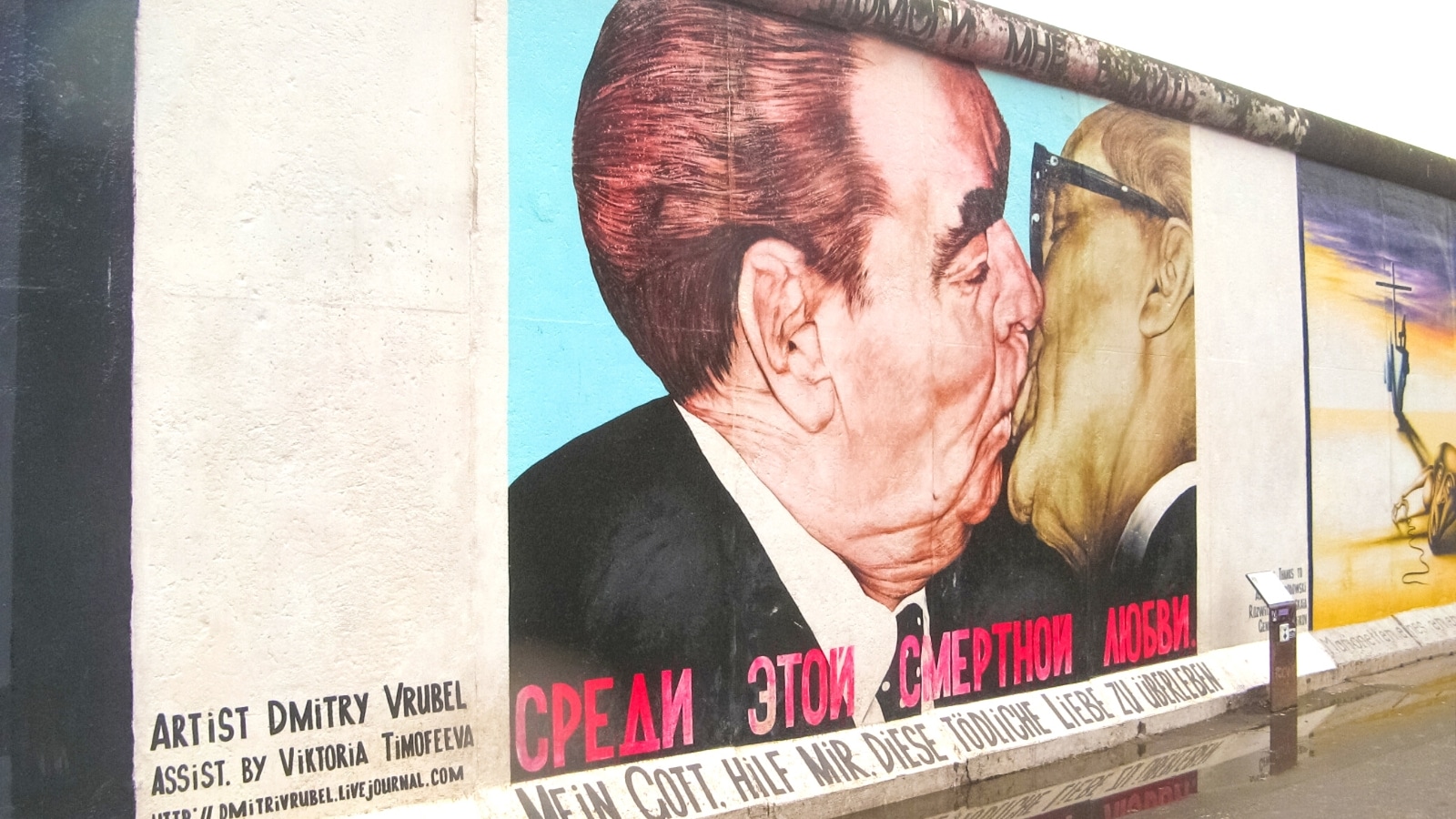 The image captures The East Side Gallery, which is renowned as the largest outdoor art gallery globally, situated on a segment of the Berlin Wall in Berlin, Germany.