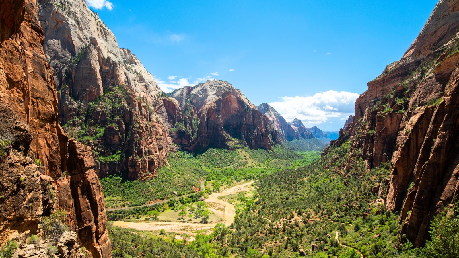 The image depicts the trail to Angels Landing in Zion National Park, located in Utah, USA. The trail is known for its challenging terrain and stunning views of the surrounding landscape.