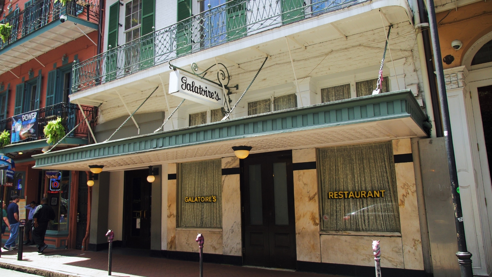 Galatoire's restaurant at 209 Bourbon Street in the French Quarter of New Orleans, Louisiana, features a prominent entrance with a canopy and a sign displaying the name.