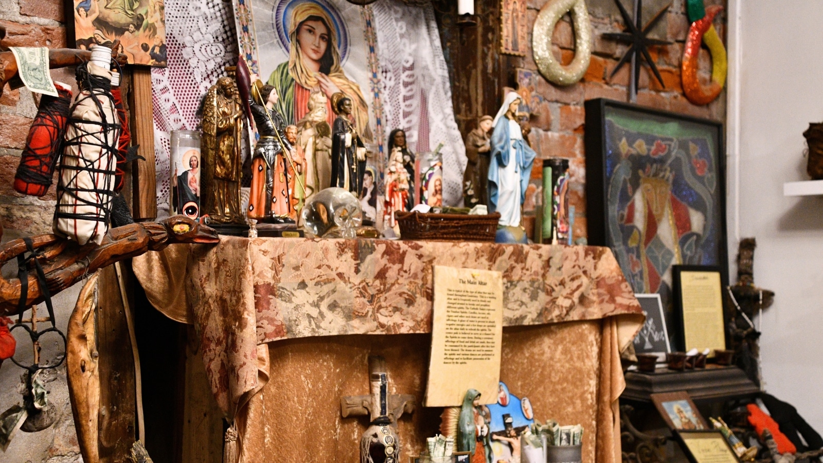 The New Orleans Historic Voodoo Museum features a booth with various exhibits. The booth contains artifacts and relics related to voodoo practices.